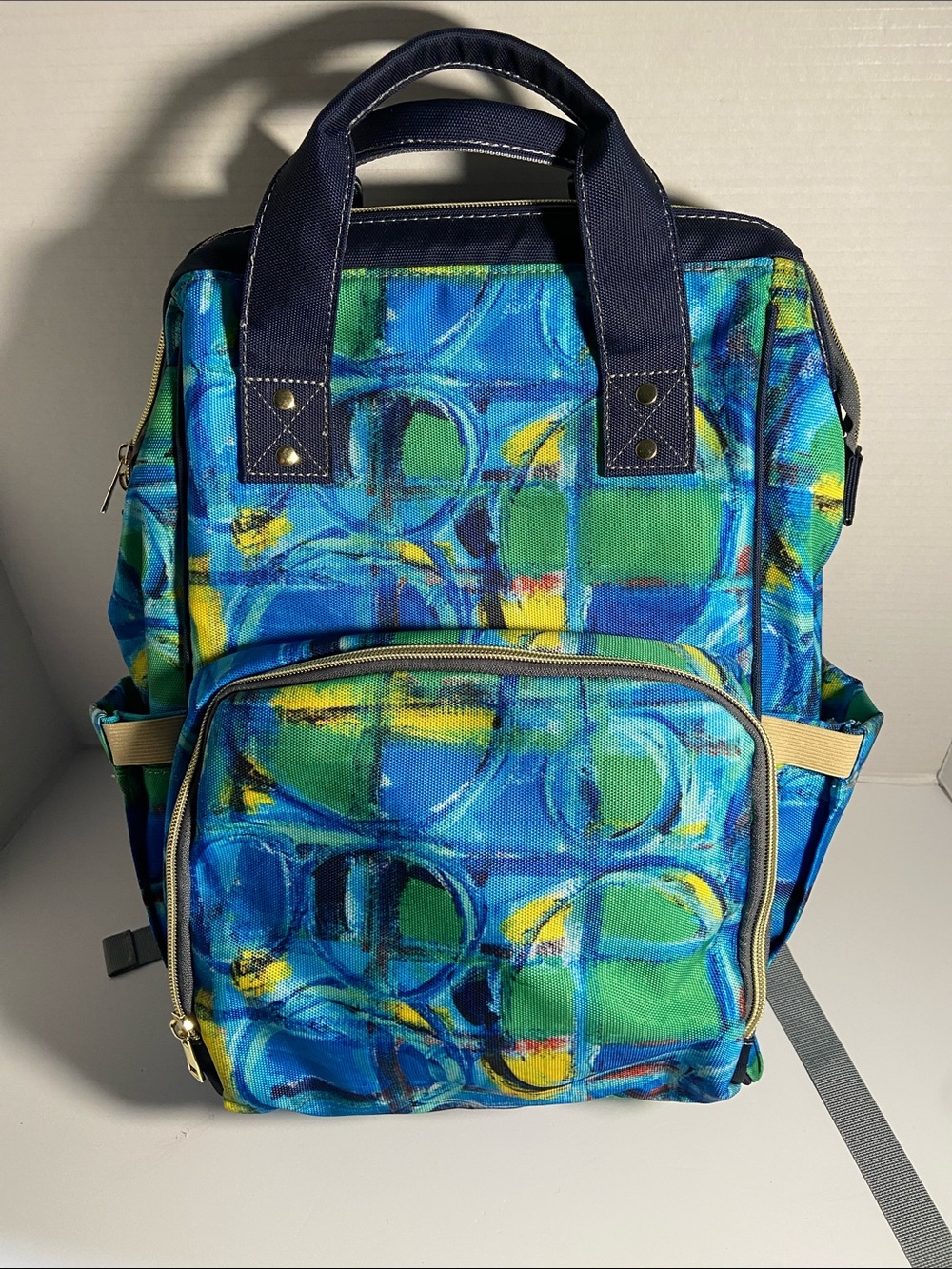 Multifunction Nylon Diaper Bag. Has backpack straps or carry handles.